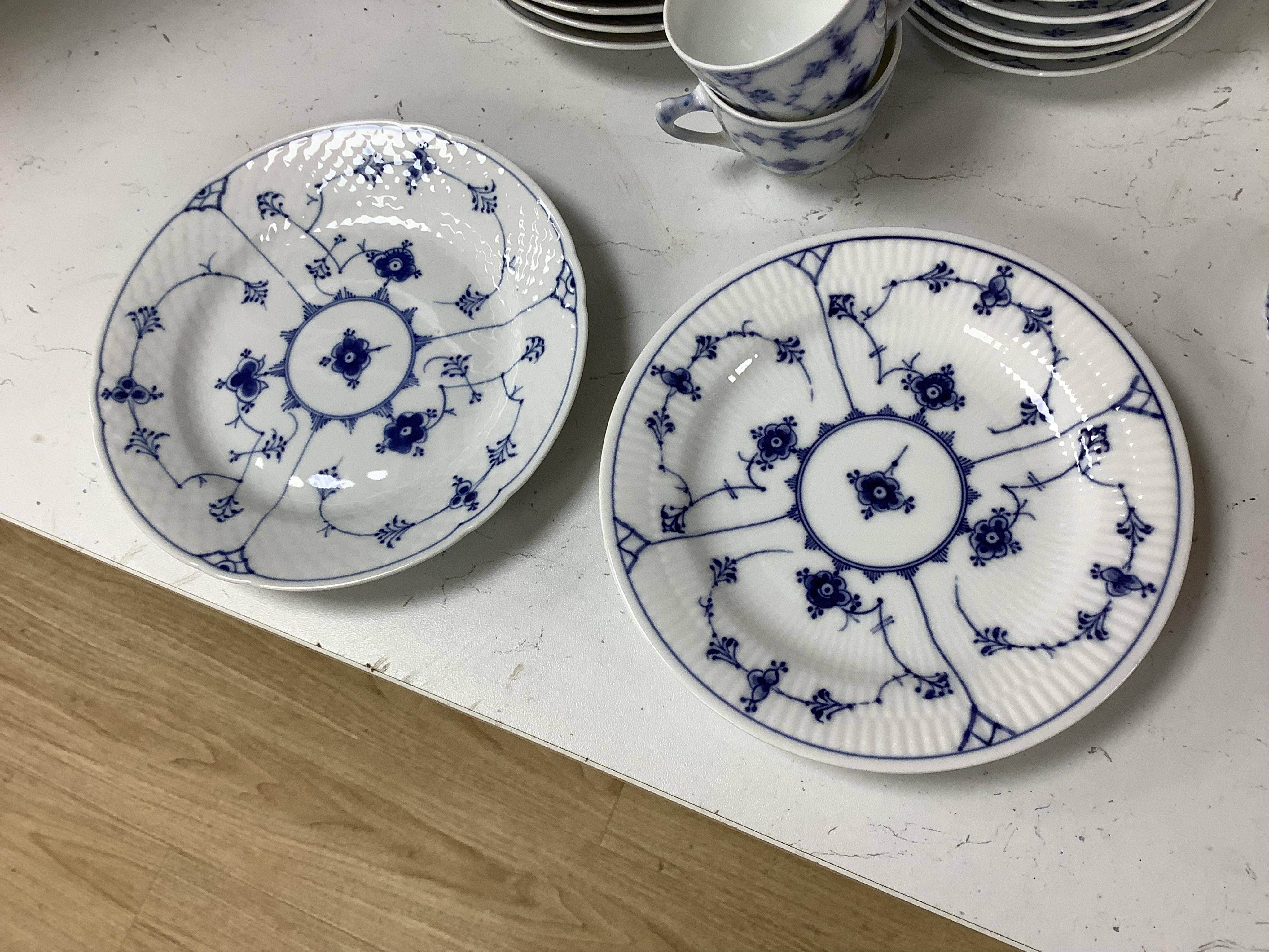 A collection of Royal Copenhagen and Bing & Grondahl onion pattern blue and white tableware